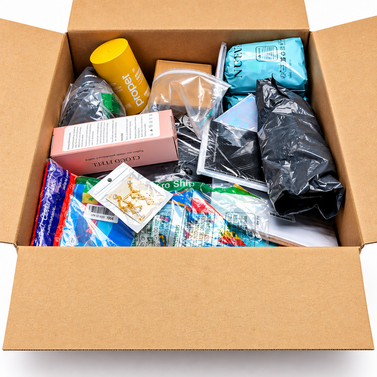 An open OG Mystery Box showing example assorted merchandise; actual contents vary